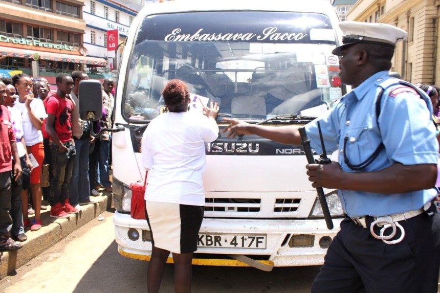 “SHAME ON YOU”! An angry protestor stops an Embassava Sacco bus. This is about 1: 05 PM. 